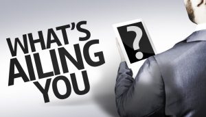 Business man with the text What's Ailing You? in a concept image